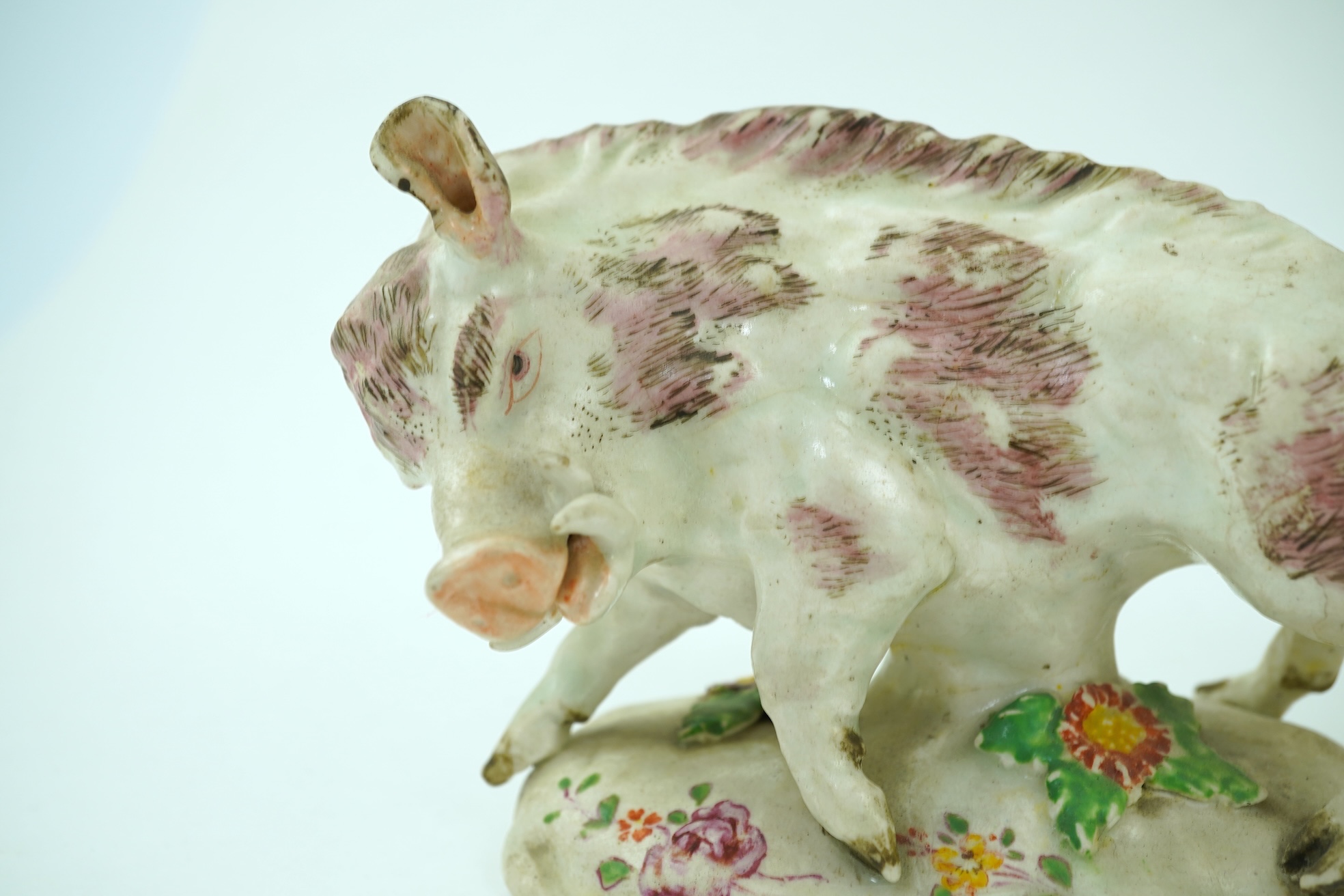A pair of early Derby porcelain models of wild boars, c.1752-55